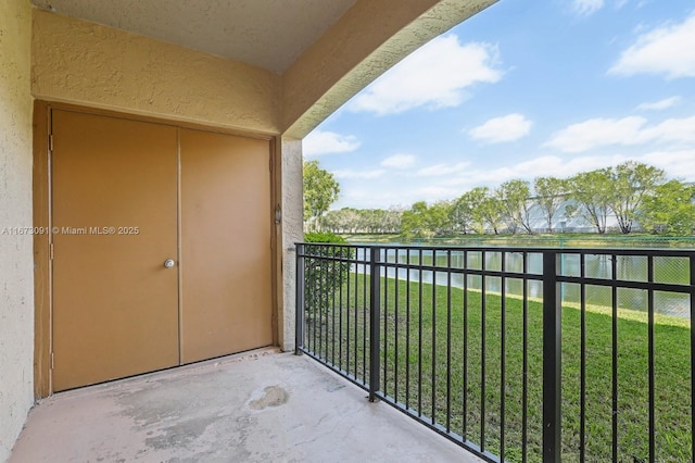 balcony featuring a water view