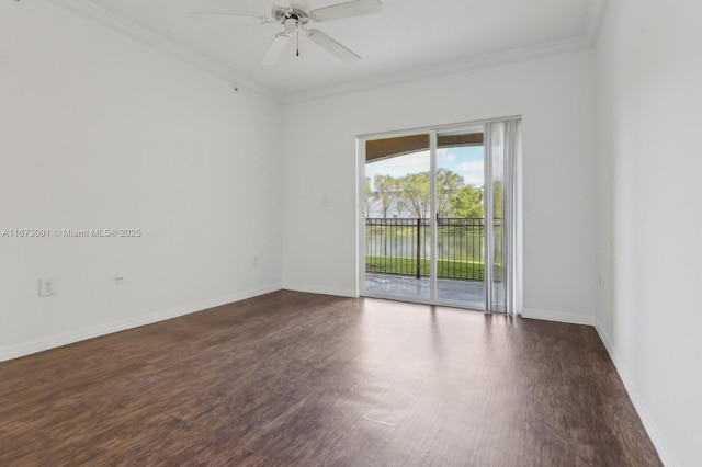 spare room featuring ceiling fan, dark hardwood / wood-style floors, and ornamental molding