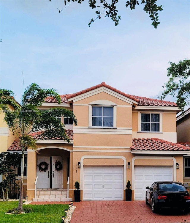 view of front of property with a garage