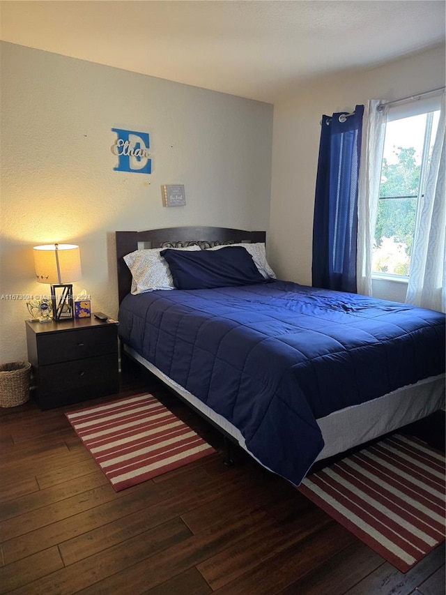 bedroom featuring dark wood-type flooring