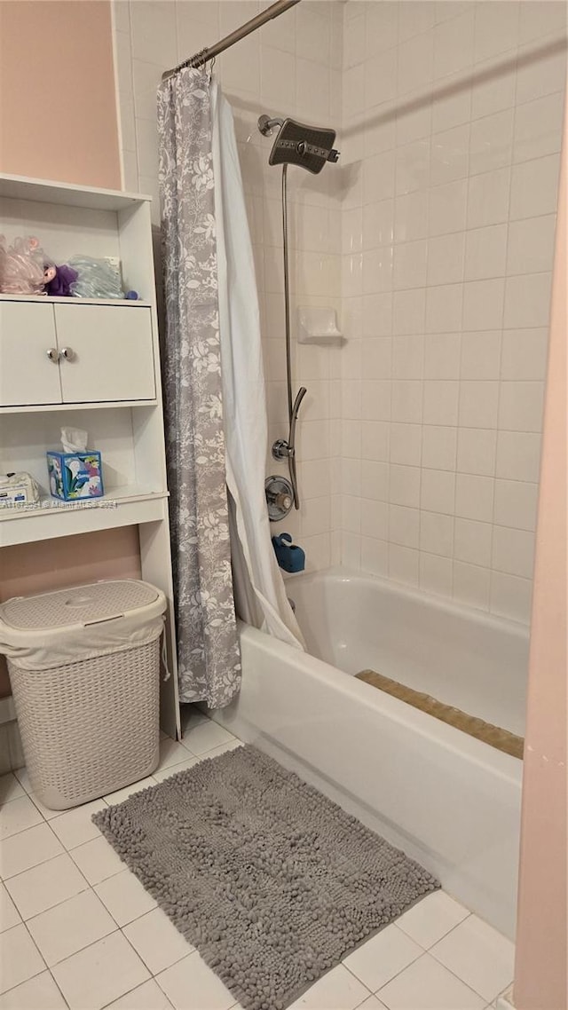 bathroom with tile patterned floors and shower / bath combination with curtain