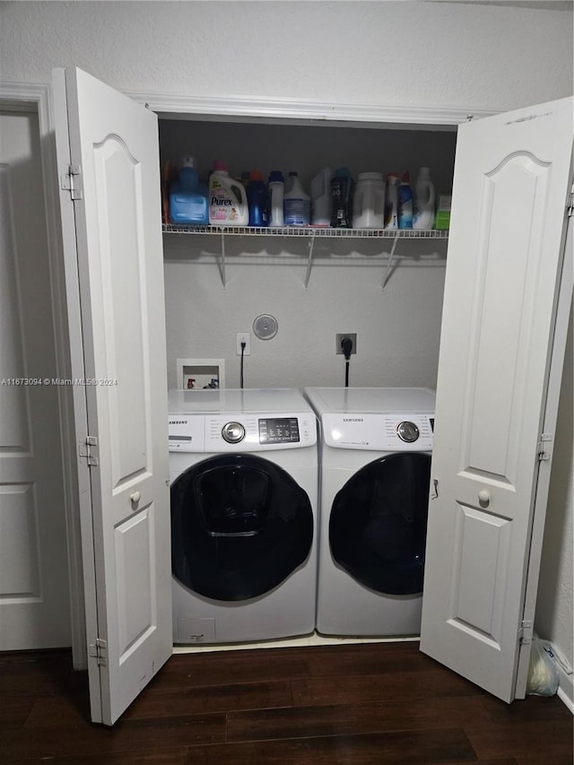 washroom featuring dark wood-type flooring and independent washer and dryer