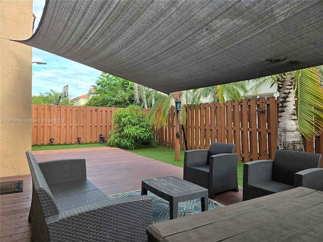 view of patio featuring a wooden deck and an outdoor living space