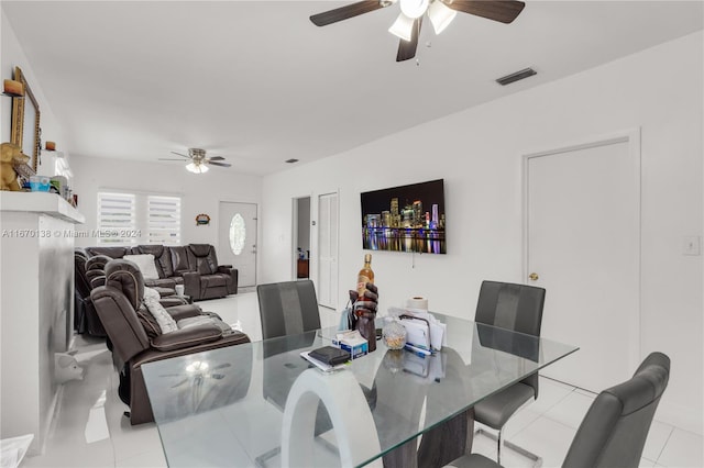 dining room with ceiling fan and light tile patterned floors