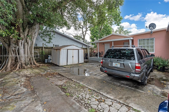 exterior space with a shed