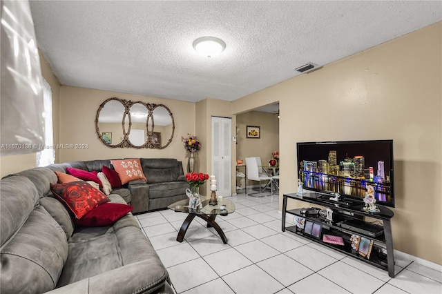 tiled living room with a textured ceiling