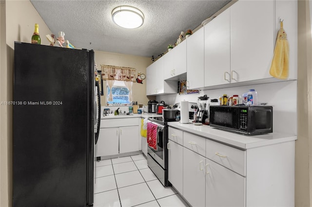 kitchen featuring white cabinetry, light tile patterned floors, a textured ceiling, black appliances, and sink