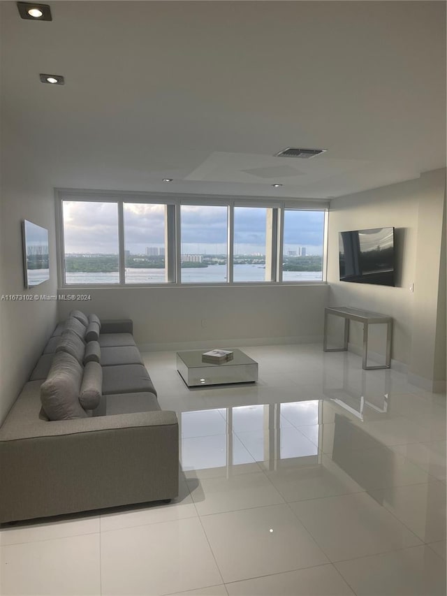 living room with tile patterned flooring