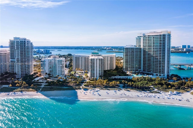 birds eye view of property featuring a view of the beach and a water view