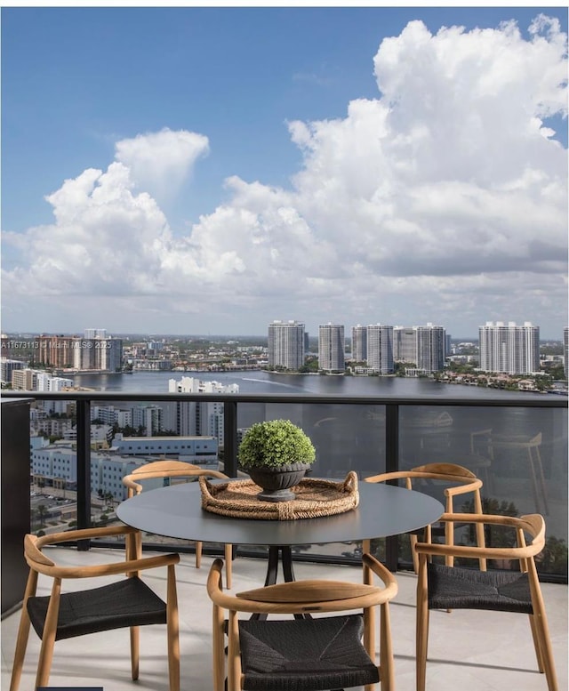 balcony featuring a water view