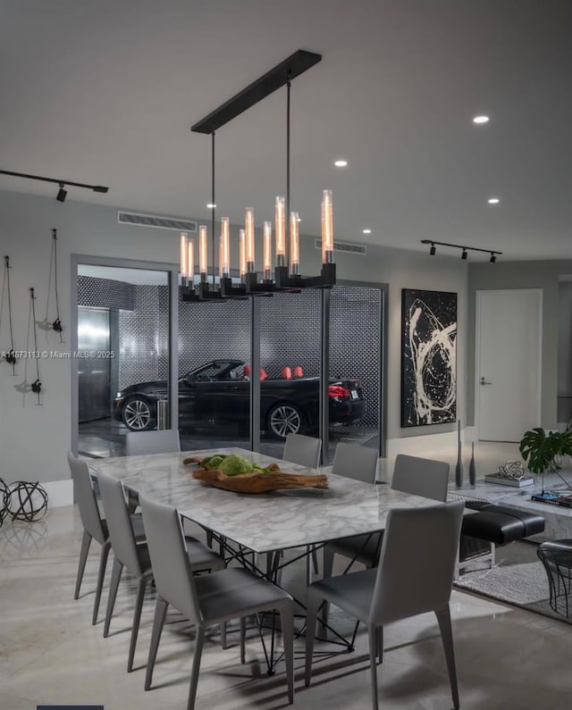 dining room featuring track lighting