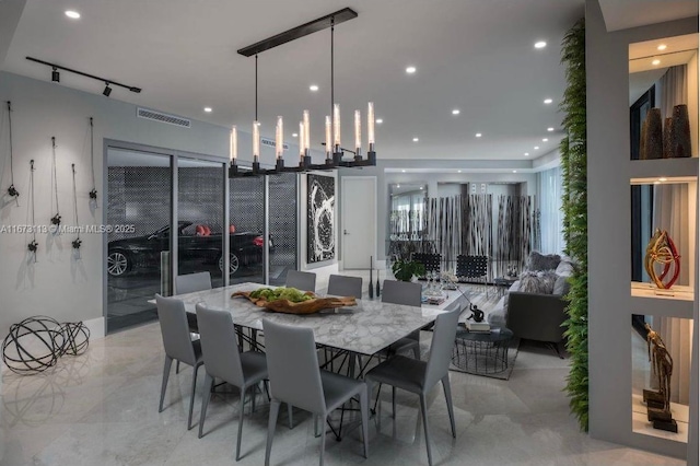 dining area featuring track lighting