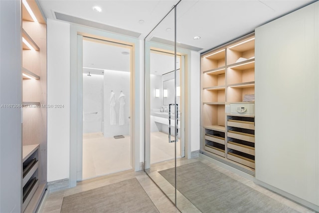 interior space with walk in shower and vanity