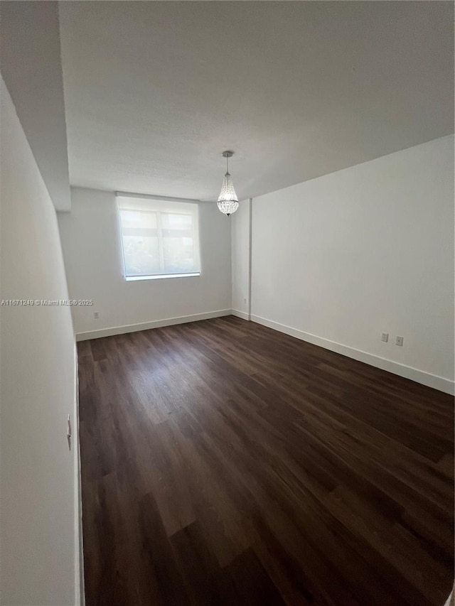 unfurnished room featuring dark hardwood / wood-style floors