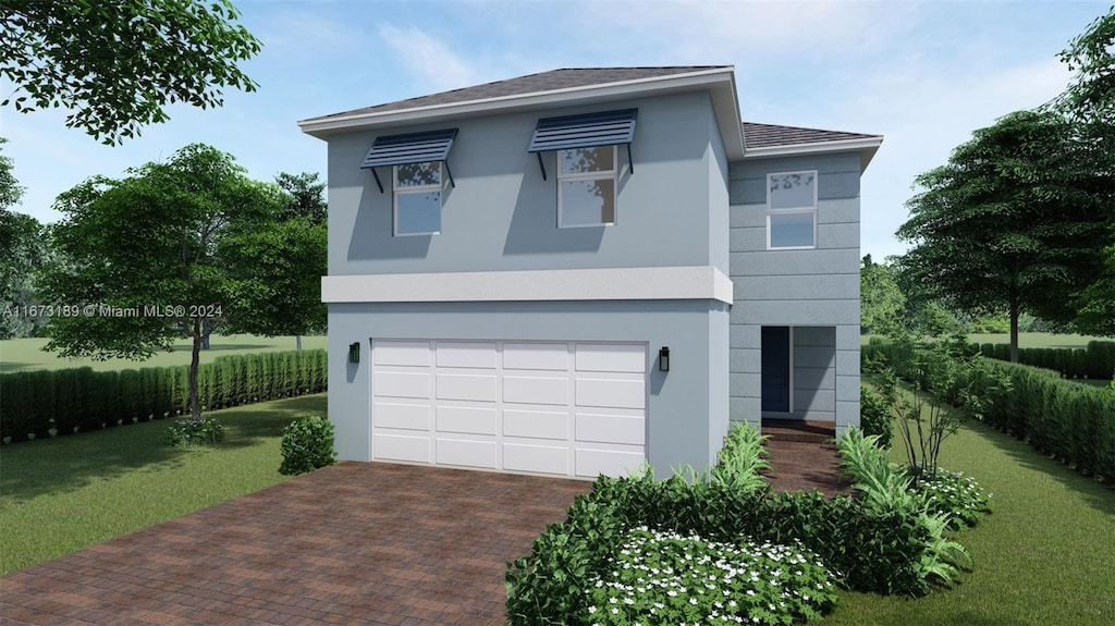 view of front of house with a garage and a front lawn