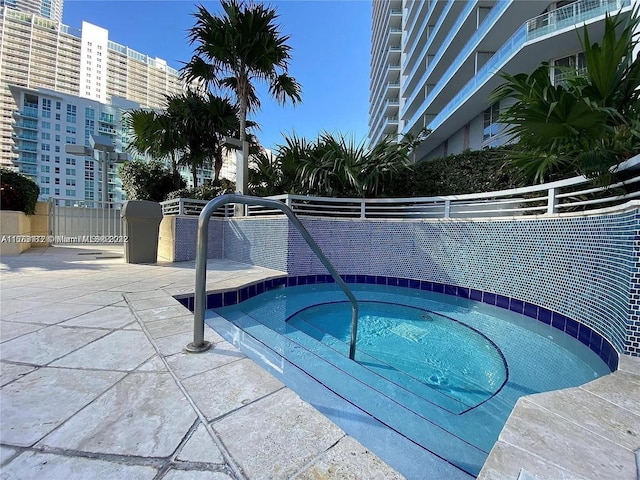 view of pool featuring a community hot tub