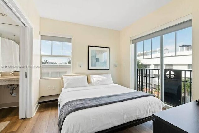 bedroom with wood-type flooring