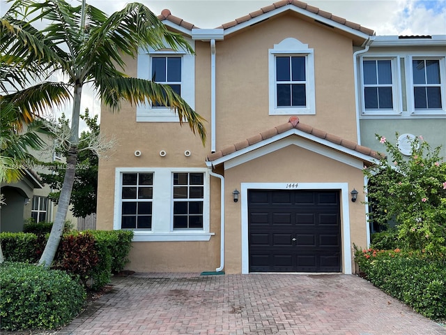 view of front of property with a garage