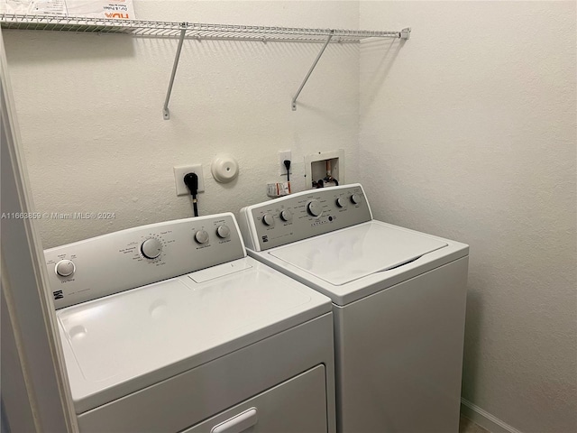 washroom featuring independent washer and dryer