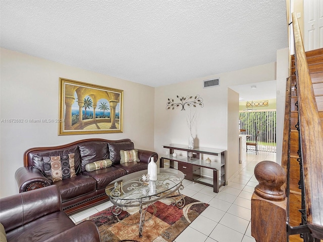 tiled living room with a textured ceiling