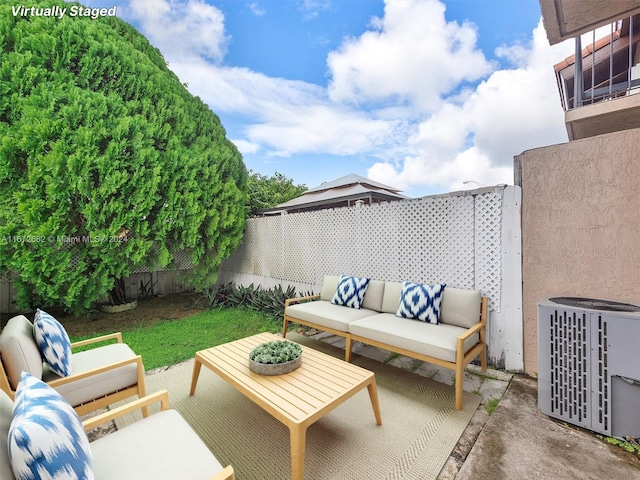 view of patio / terrace featuring an outdoor living space and central AC