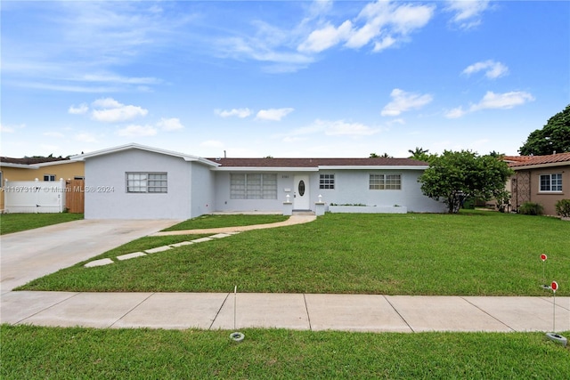 ranch-style house with a front lawn