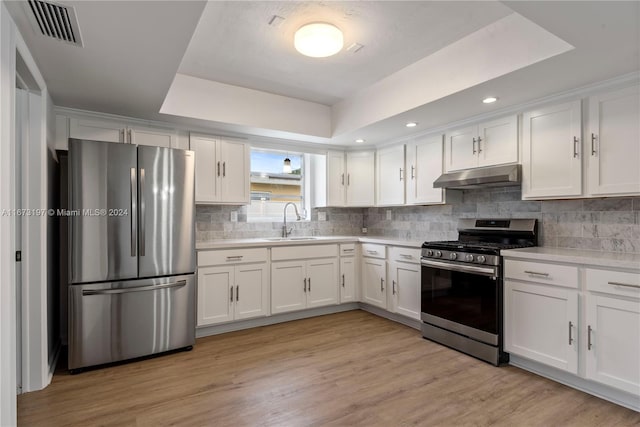 kitchen with white cabinets, sink, and stainless steel appliances