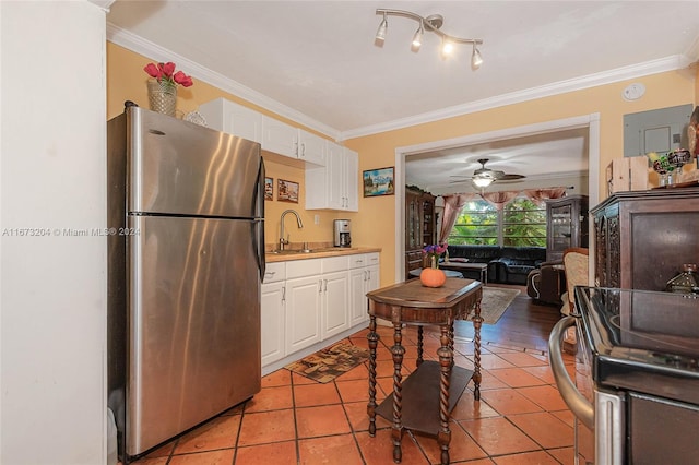 kitchen with ornamental molding, stainless steel appliances, sink, and white cabinets