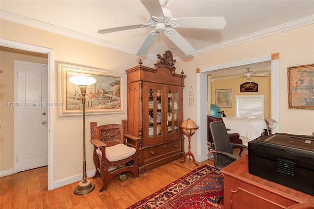 office space featuring hardwood / wood-style flooring, ornamental molding, and ceiling fan