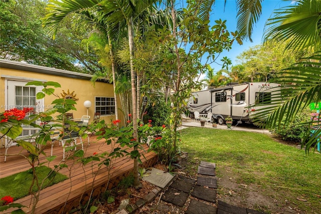 view of yard with a wooden deck