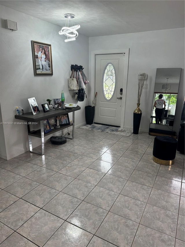 entrance foyer featuring a notable chandelier