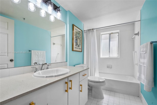 full bathroom with tile patterned floors, shower / bath combo with shower curtain, vanity, and toilet