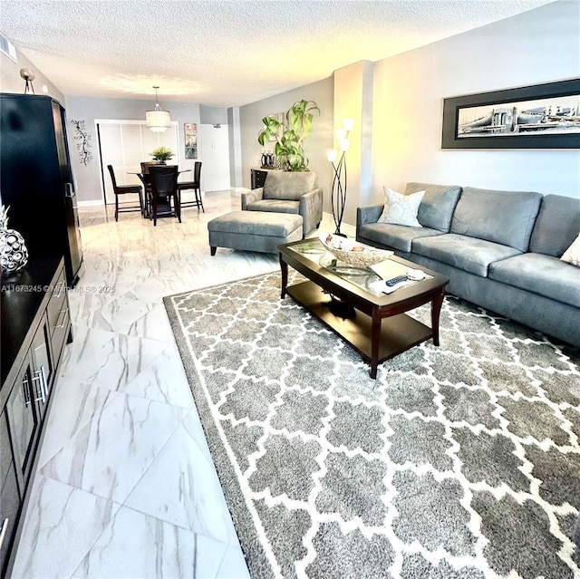 living room with a textured ceiling