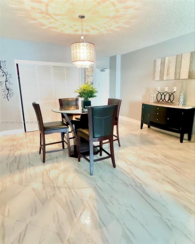 dining area featuring a textured ceiling