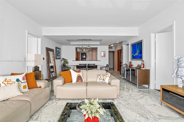 living room featuring an inviting chandelier