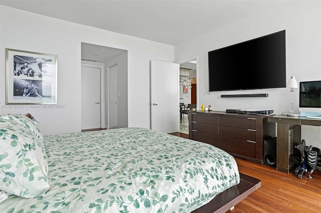 bedroom featuring wood finished floors