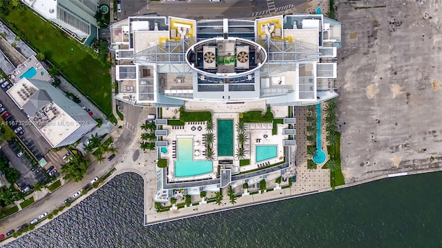 birds eye view of property with a water view