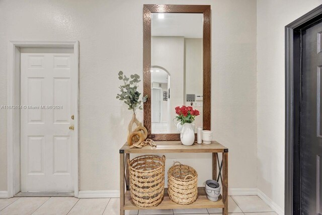 entryway with light tile patterned floors