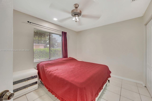 bedroom with light tile patterned floors and ceiling fan