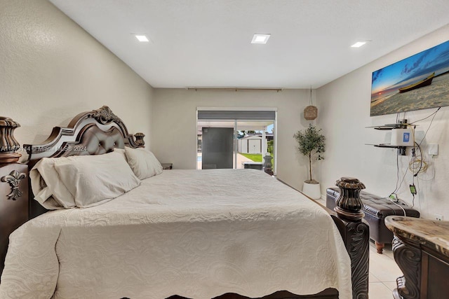 bedroom featuring access to outside and light tile patterned floors