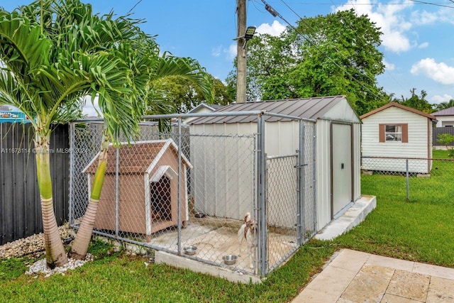 view of outdoor structure featuring a lawn