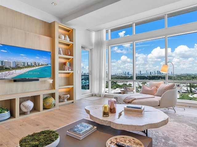 living room featuring light hardwood / wood-style floors and built in features