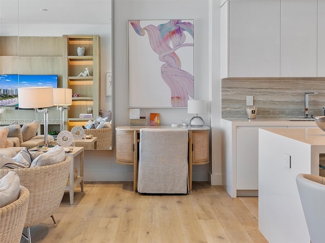 interior space with light wood-type flooring and sink