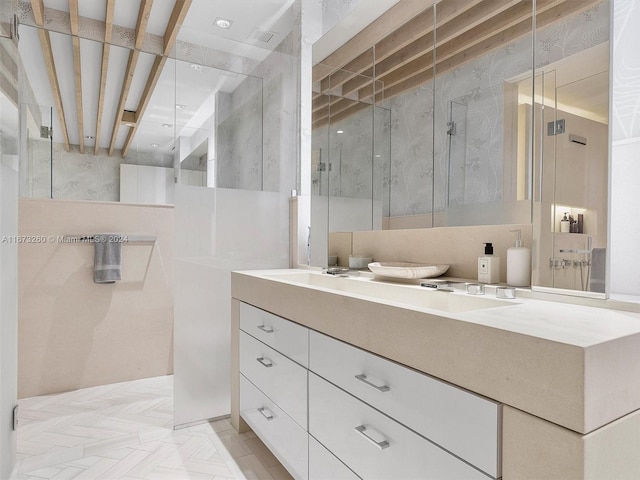 bathroom with vanity and a shower with shower door