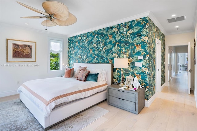 bedroom with ceiling fan, ornamental molding, and light hardwood / wood-style floors