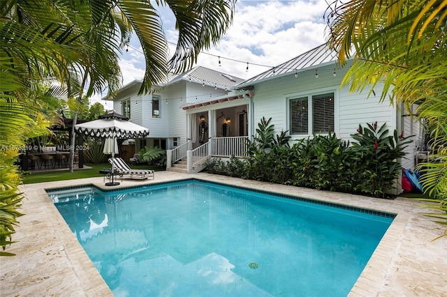 view of swimming pool featuring a patio area