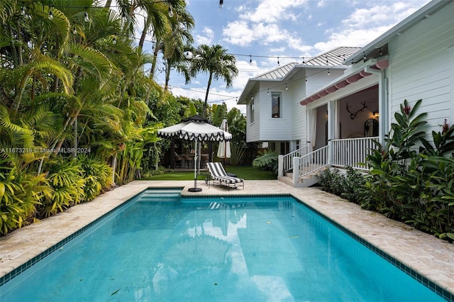 view of pool featuring a patio