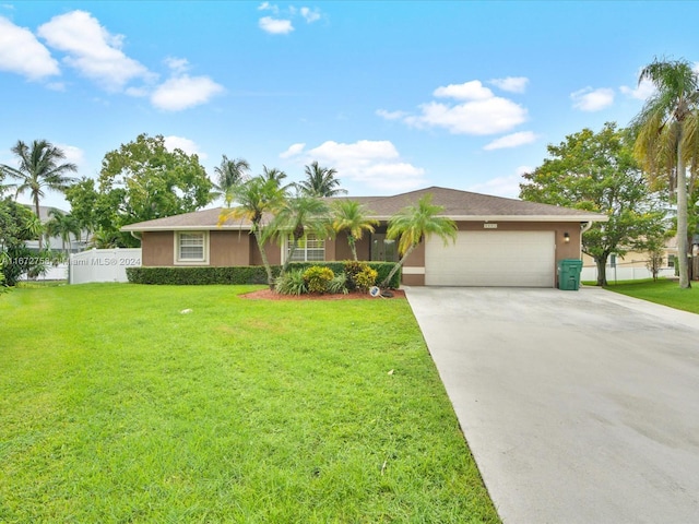 single story home featuring a front yard and a garage