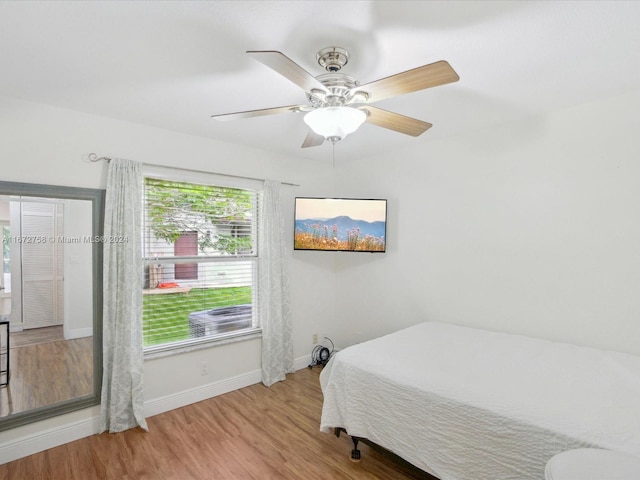 bedroom featuring light wood-type flooring and ceiling fan