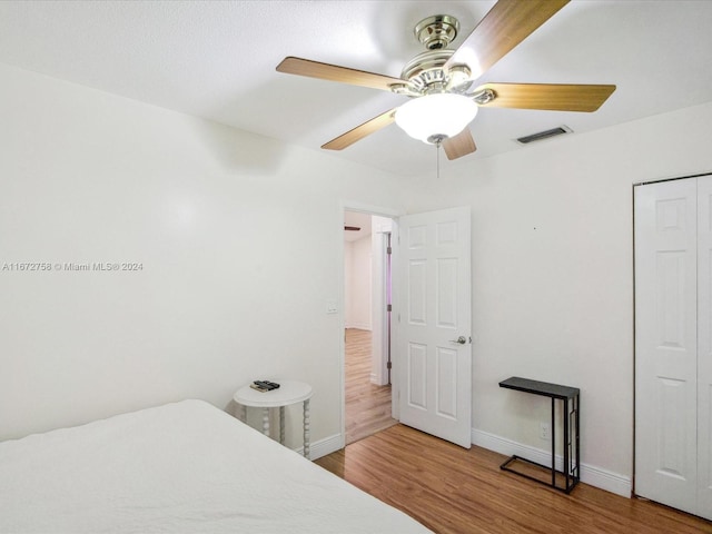 bedroom featuring ceiling fan and hardwood / wood-style flooring